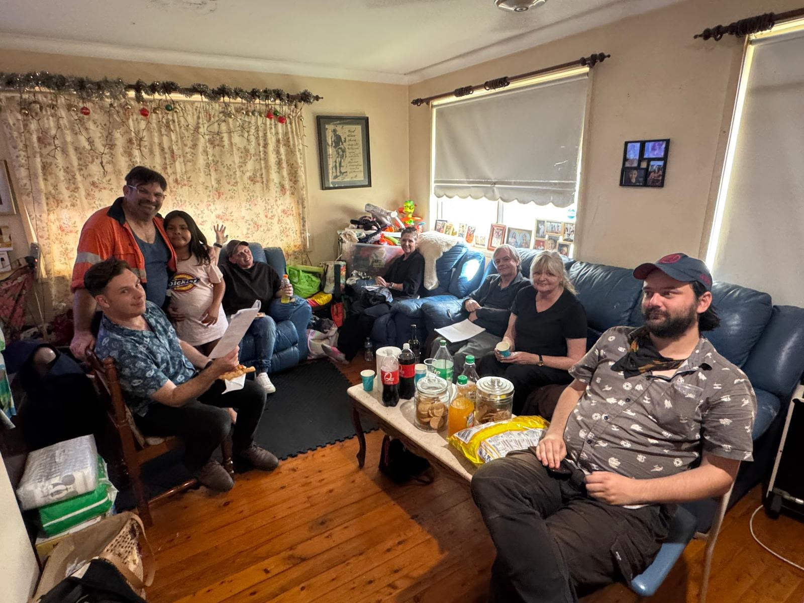 Cast and crew doing a table read of the script