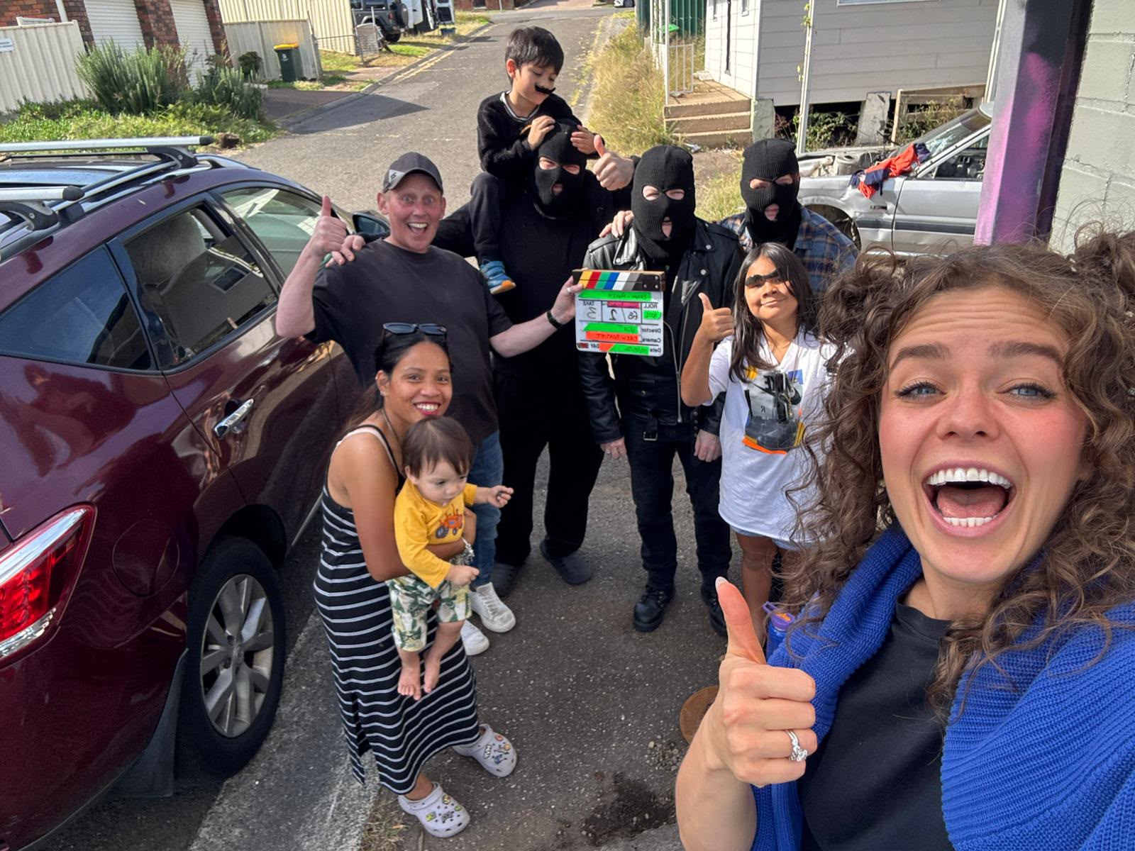 Cast and crew on location in the street